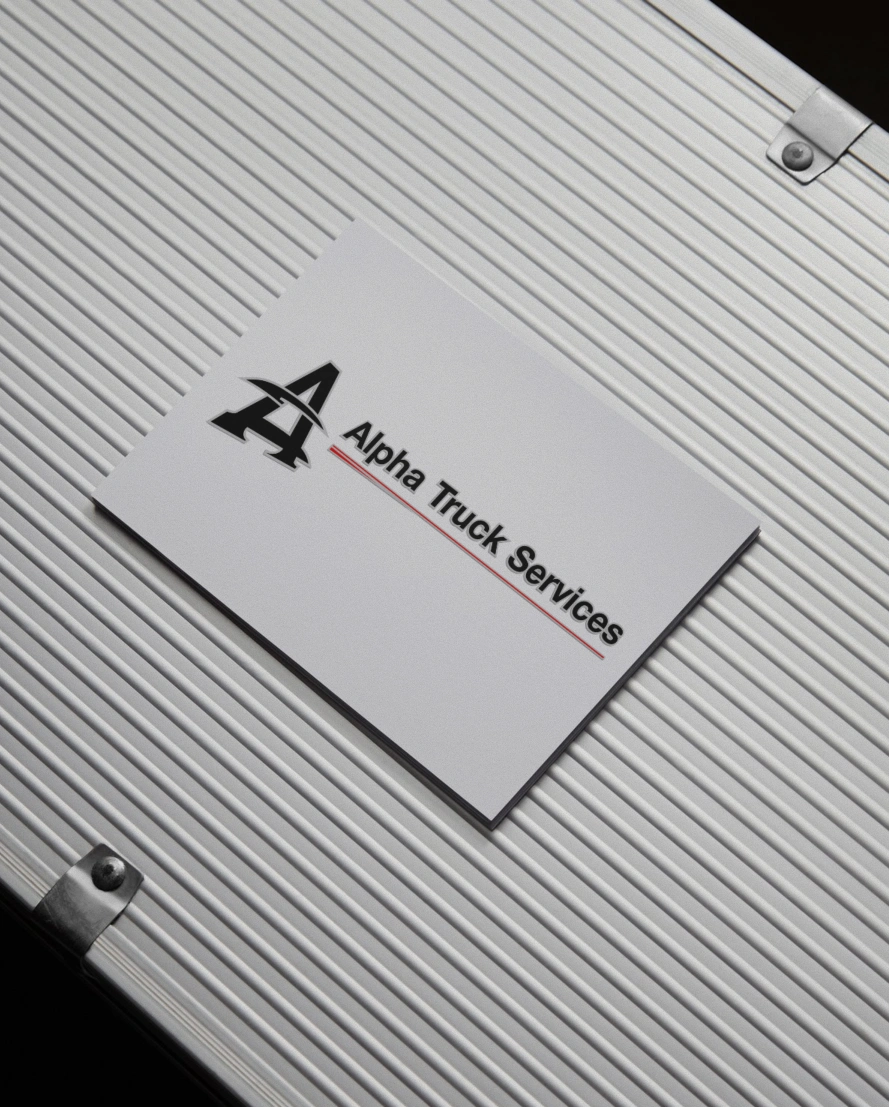 Alpha Truck Services logo design on business card