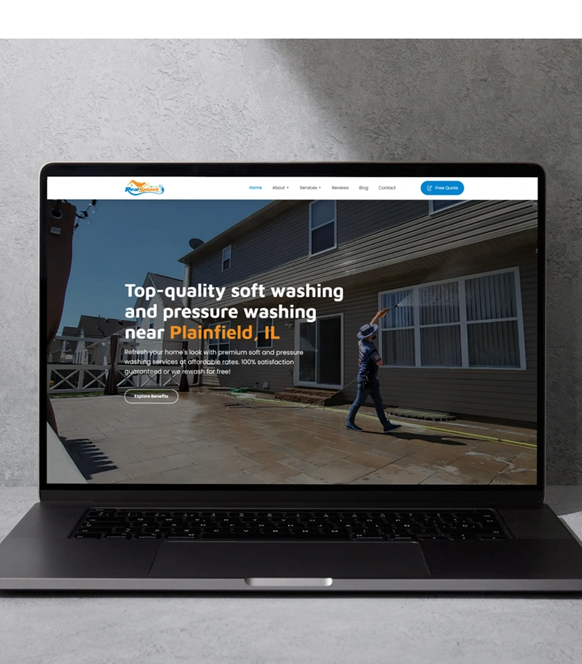 RealSplash Power Wash website displayed on laptop showing pressure washing services homepage