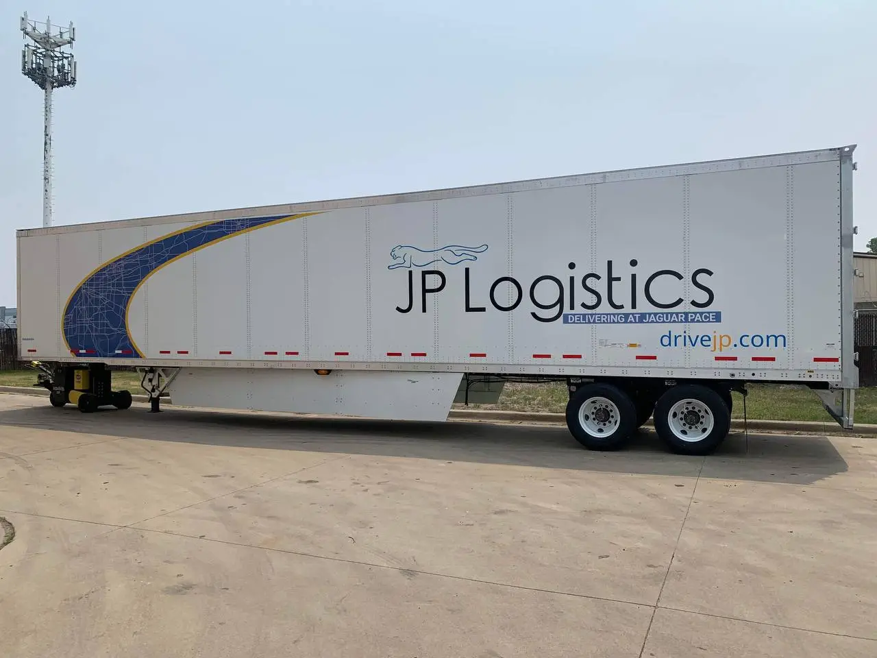 JP Logistics trailer with large logo design